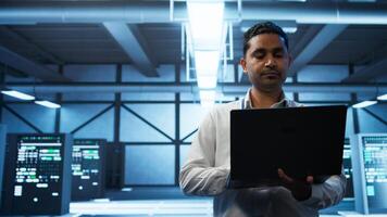 System administrator in data center managing servers, operating systems and software applications. Expert in server hub ensuring networks are secure, up to date, and functioning properly, camera B photo
