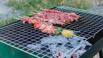 Blurred image,Barbecue BBQ skewered on a charcoal grill is a street food that is convenient for a party or picnic and barbecue BBQ is also increasing its popularity in many countries. photo