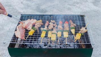 Blurred image,Barbecue BBQ skewered on a charcoal grill is a street food that is convenient for a party or picnic and barbecue BBQ is also increasing its popularity in many countries. photo