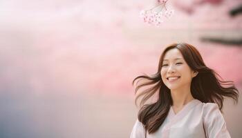 A beautiful Asian girl smiling happily, radiating joy and positivity. The image captures her genuine and cheerful expression, making it ideal for content related to happiness, positive emotions photo