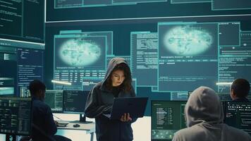 Hackers group failing to hack a system in high tech agency office, reading critical error message on big screen. Specialists trying to steal important database information from rival states. Camera B. photo