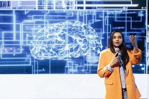 Engaging speaker talking at AI conference, sharing industry expertise to inspire and motivate audience. IT expert exploring latest artificial intelligence solutions, technologies and tools at event photo