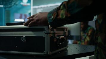 Military IT expert ensures monitoring room operation by collecting real time surveillance from satellite systems, supporting strategic operations. Ensure national defense and protocols. Camera B. photo