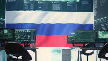 Governmental cyber operations room with Russian flag on big screen, focusing on information war and trolling. Highlighting the role of hackers in spreading disinformation and crowd control. Camera B. photo
