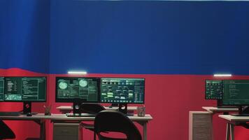 Empty governmental hacking room with Russian flag on big screen, highlighting cyber terror and misinformation. Russian federation manipulating with disinformation campaigns. Hybrid warfare. Camera A. photo