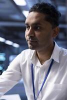 System administrator ensuring data center servers are properly equipped to provide redundancy, automatic failover and rapid reconfiguration of clusters to minimize failure of individual machines photo