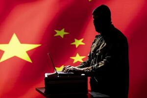 China military engineer creating fake accounts on social media to persuade other nations to act in the Chinese government interests. CCP intelligence operator spreading misinformation online photo