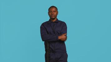 Portrait of security staff member tasked with evicting trespassers while following legal protocols. Patrolling agent maintaining secure environment, studio background, camera B photo
