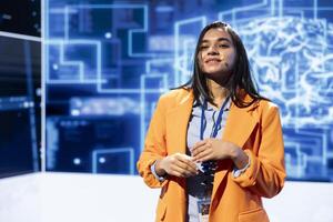 Happy speaker talks at AI event gathering tech startups managers, investors and academics. Smiling expert hosts sessions geared towards helping IT business leaders tap into artificial intelligence photo