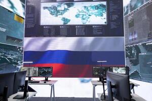 Empty military command center drone control agency with the russian flag on big screen, spreading misinformation and fake news to scare the population. Russian federation army. photo