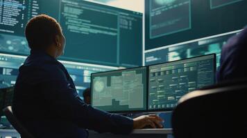 Cyber security expert working on encryption and IT security in a governmental agency. Woman engaging on cyber operations, network security and data protection for hybrid war. Camera B. photo