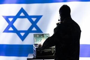 Israel Mossad agent working on laptop, analyzing aerial reconnaissance data to come up with warfare winning tactics. Intelligence corps agent controlling drones attacking strategic targets photo