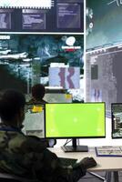 Control center operator tracking all ships along the coast line, uses isolated chroma key screen in monitoring room. Army trained personnel helps with real time big data, reconnaissance. photo