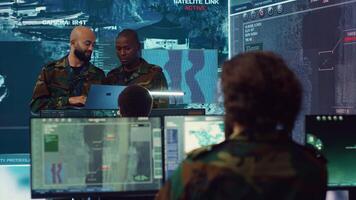 Army officers providing details for a new national safety mission, diverse team briefing their soldiers in a military base of operations. Specialists working with reconnaissance big data. Camera A. photo