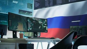 Empty army command post with the russian flag running on big screen, russian federation and government working on propaganda to spread fake news among the population. Camera B. photo