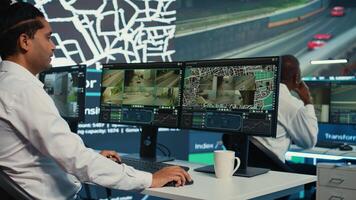 Team of employees monitoring delivery trucks with gps coordinates on satellite navigation, tracking orders with awb shipping system. Operators working in control center. Camera B. photo