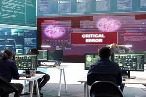 Hackers group failing to hack a system in high tech agency office, reading critical error message on big screen. Specialists trying to steal important database information from rival states. photo