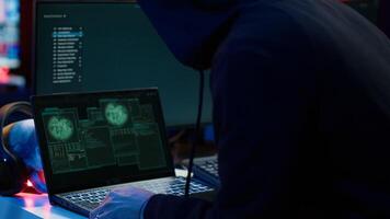 Hacker arriving in underground HQ with laptop in suitcase, ready to start coding malware. Cybercriminal opening notebook to exploit network backdoors and bypass security measures, close up, camera A photo