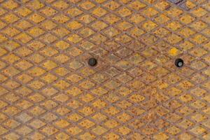 Rusty Metal Background Image is metal that has been corroded by moisture to the surface causing iron rust to form on the surface of the object. Rough patterns and surfaces are caused by corrosive rust photo