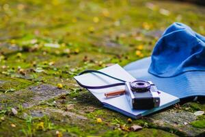 A young photographer is traveling and capturing impressive images of the temple with a film camera. Young photographer chooses to travel and record impressive images in Chiang Mai, Thailand photo