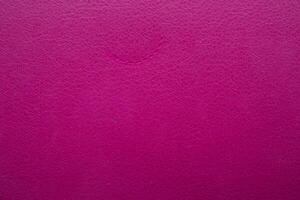pink faux leather background is used to wrap book covers or to repair everyday leather sofa seats and appliances. background and pattern on the pink faux leather have space for text. photo
