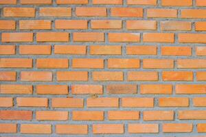 Brick wall background is a wall made of clay bricks, giving the structure strength and cement line between bricks that looks beautiful. It is popular to build a wall of ancient monuments.copy space, photo