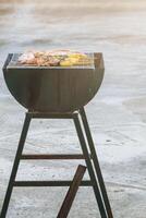 Blurred image,Barbecue BBQ skewered on a charcoal grill is a street food that is convenient for a party or picnic and barbecue BBQ is also increasing its popularity in many countries. photo