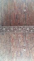 Brick wall background is a wall made of clay bricks, giving the structure strength and cement line between bricks that looks beautiful. It is popular to build a wall of ancient monuments.copy space, photo