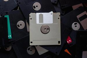 A square floppy disk is a magnetic disk for storing data in an old computer with a small capacity, but floppy disks were still popular in those days because there was no alternative. photo