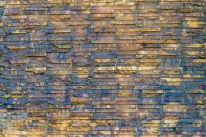 Brick wall background is a wall made of clay bricks, giving the structure strength and cement line between bricks that looks beautiful. It is popular to build a wall of ancient monuments.copy space, photo