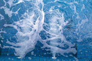 air bubbles ejected in water with a pressure generator inside the jacuzzi relax the body when immersed in the bath as it is a water pressure massage system. Bathtub Background with Copy Space photo
