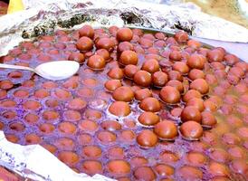 Indian dessert gulab jamun in party an wedding photo
