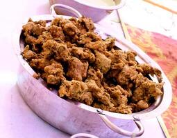 Crispy onion bhajis or kanda or pyaj ke pakore or pakoda photo