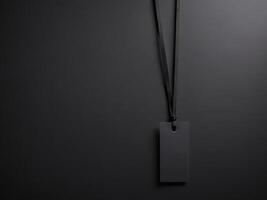 Black Paper Price Label With String Isolated on black background. photo