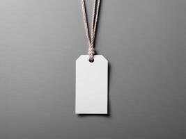 White Paper Price Label With String Isolated on gray background. photo