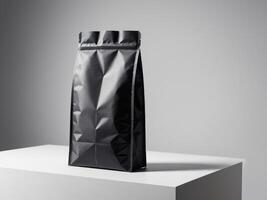 Black paper doypack placed on podium on empty background. photo