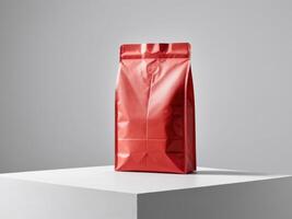 red paper doypack placed on a podium on an empty background. photo