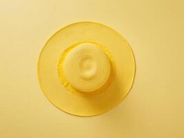 yellow beach hat isolated on yellow background. photo