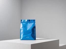 Blue paper doypack placed on podium on empty background. photo