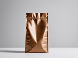 A bronze paper doypack is placed on a podium with an empty background. photo