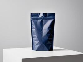 navy blue paper doypack placed on a podium on a blank background. photo