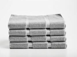 Neatly folded gray towel isolated on white background. photo