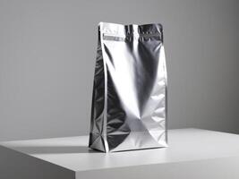 silver paper doypack placed on a podium on a blank background. photo