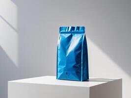 Blue paper doypack placed on podium on empty background. photo