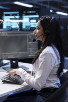 Data center support specialist responsible for providing and coordinating physical and logical support to customers. IT expert overseeing infrastructure systems and communicating with engineers photo