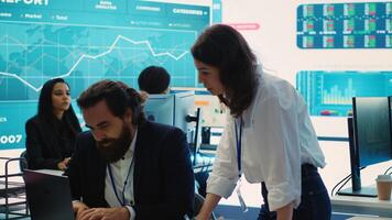 Staff member pitching an expansion idea directly to the business investor, presenting key performance indicators and annual success reports in order to obtain more funds. Camera A. photo
