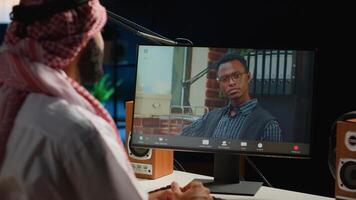 Arabic worker in call session with therapist, asking for advice, feeling down. Remotely working Middle Eastern employee in online consultation with psychologist from stylish cozy home photo