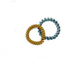Two Spiral Plastic rubber hair band on the white background photo