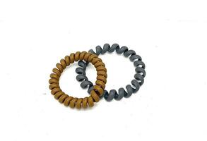 Two Spiral Plastic rubber hair band on the white background photo