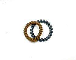 Two Spiral Plastic rubber hair band on the white background photo